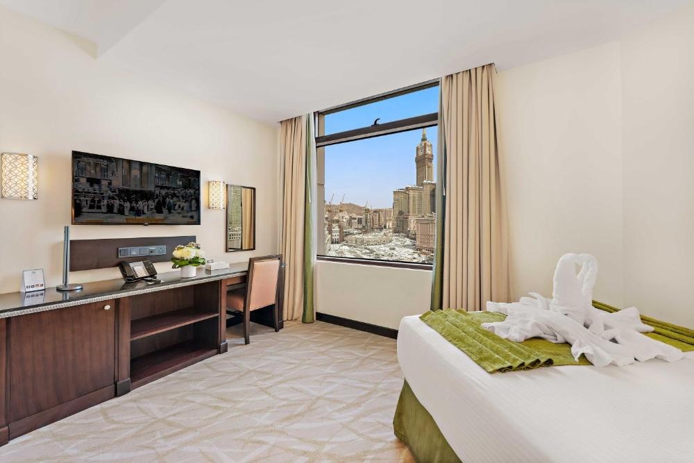Comfortable room with media setup at Anjum Mecca